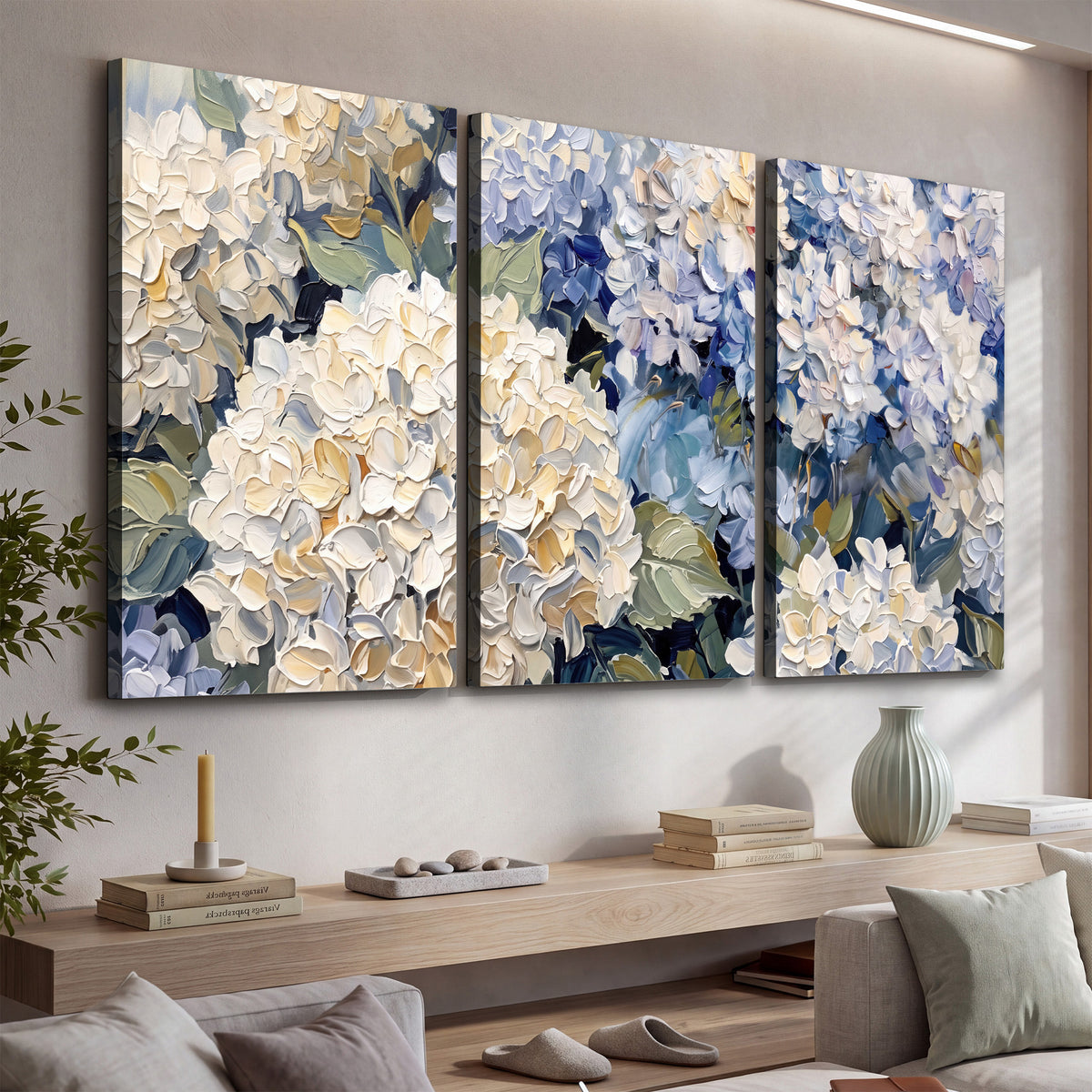 Clusters of pale blue and ivory hydrangea blossoms 3 piece canvas wall art displayed in a console
