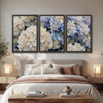 Clusters of pale blue and ivory hydrangea blossoms 3 piece framed canvas wall art displayed in a bedroom
