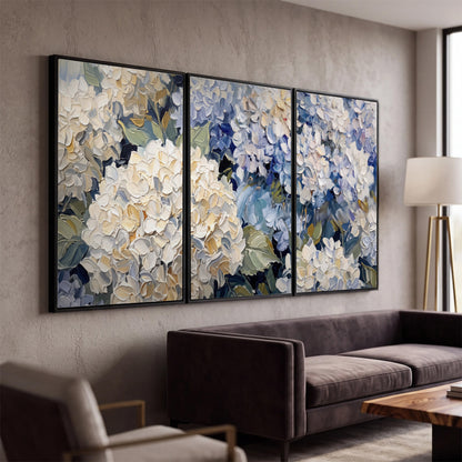Clusters of pale blue and ivory hydrangea blossoms 3 piece framed canvas wall art displayed in a modern living room