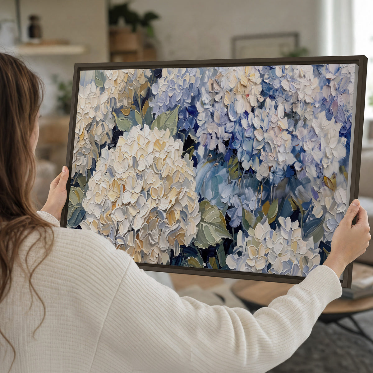 Clusters of pale blue and ivory hydrangea blossoms single framed canvas wall art held in hands