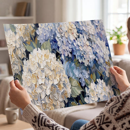 Clusters of pale blue and ivory hydrangea blossoms single poster print held in hands