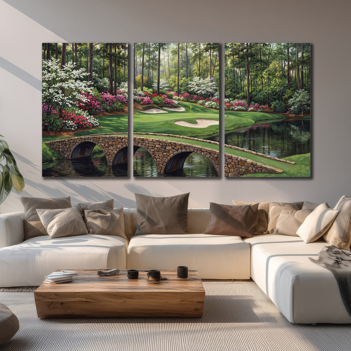 An arched stone bridge beside a landscaped golf course and reflective pond 3 piece canvas wall art displayed in a living room