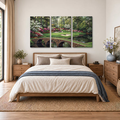 An arched stone bridge beside a landscaped golf course and reflective pond 3 piece canvas wall art styled in an interior