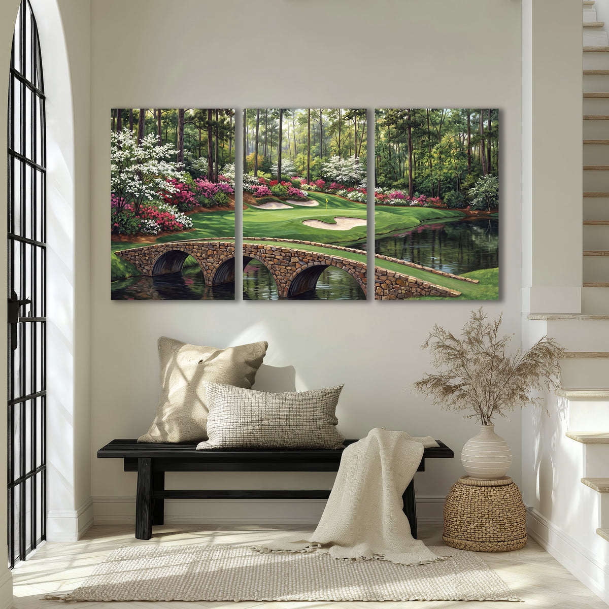 An arched stone bridge beside a landscaped golf course and reflective pond 3 piece canvas wall art displayed in a entryway