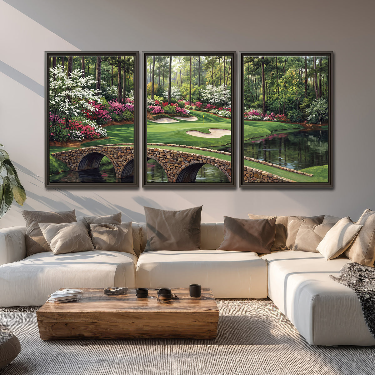 An arched stone bridge beside a landscaped golf course and reflective pond 3 piece framed canvas wall art displayed in a living room