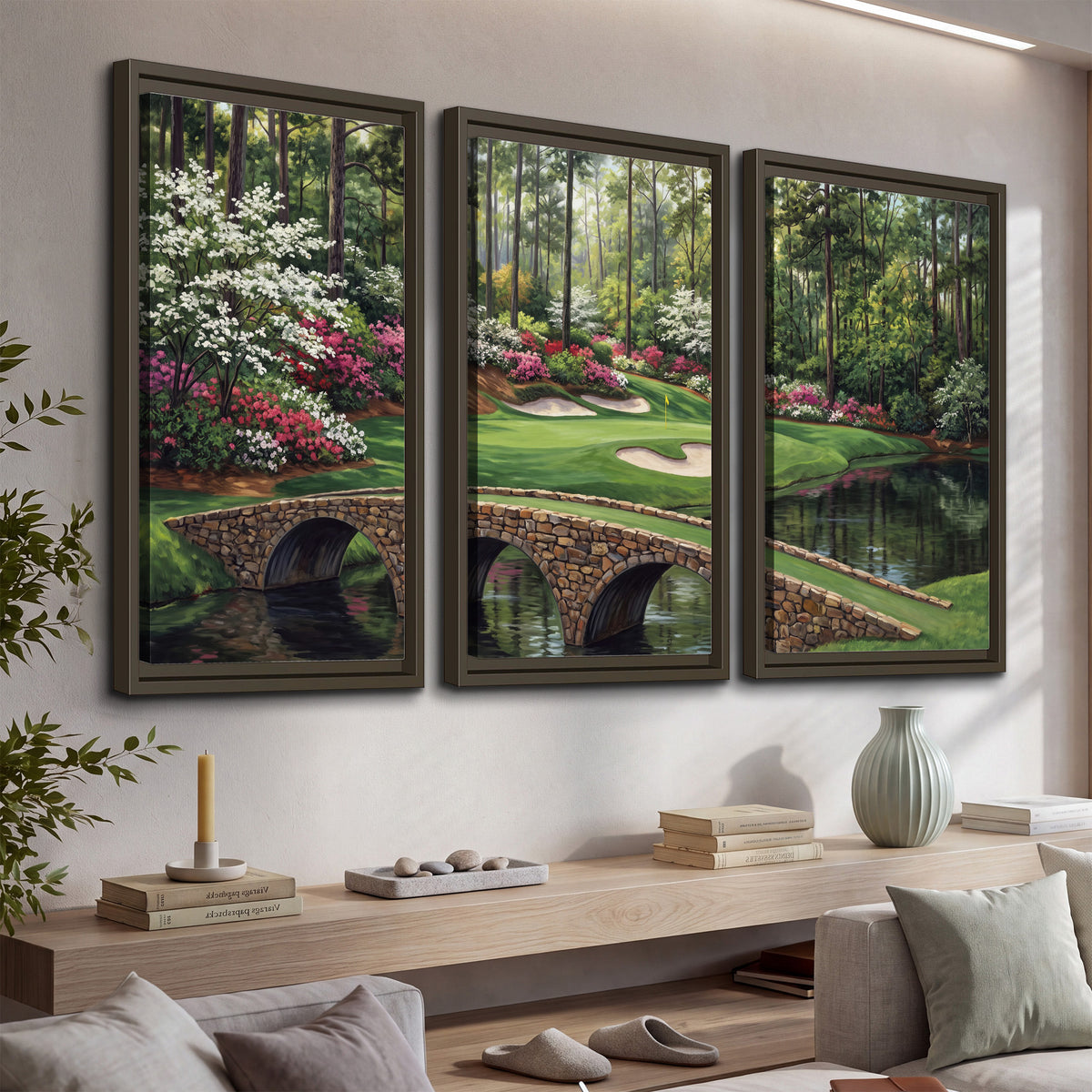 An arched stone bridge beside a landscaped golf course and reflective pond 3 piece framed canvas wall art displayed in a console