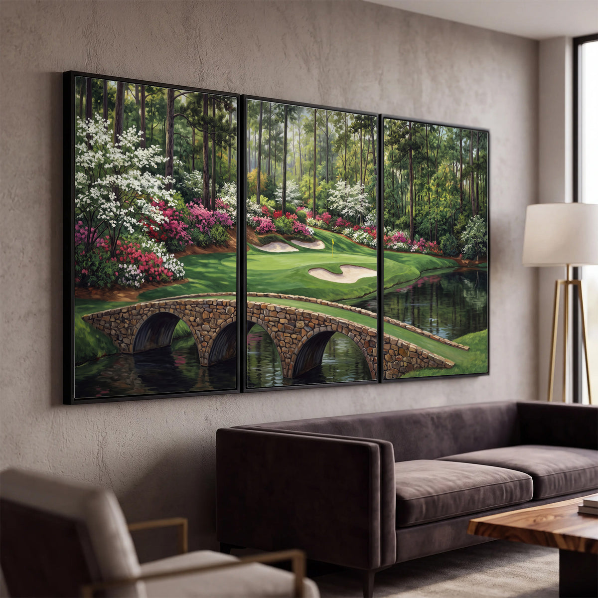 An arched stone bridge beside a landscaped golf course and reflective pond 3 piece framed canvas wall art displayed in a modern living room