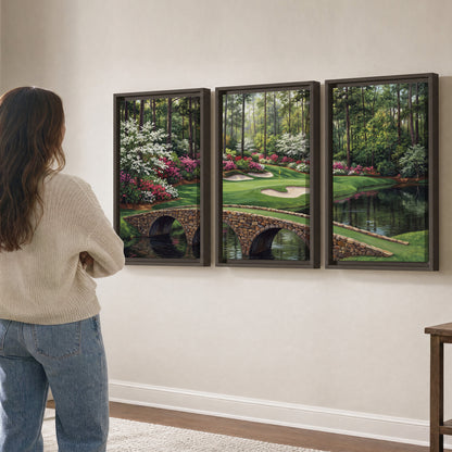 An arched stone bridge beside a landscaped golf course and reflective pond 3 piece framed canvas wall art three panel arrangement on a wall