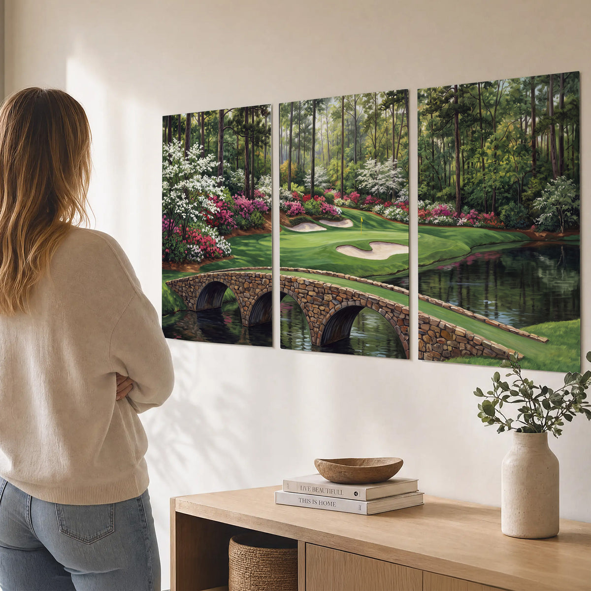 An arched stone bridge beside a landscaped golf course and reflective pond set of 3 poster prints three panel arrangement on a wall