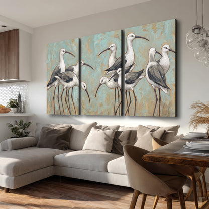 Long-legged white and gray wading birds against a muted aqua background 3 piece canvas wall art room and product view