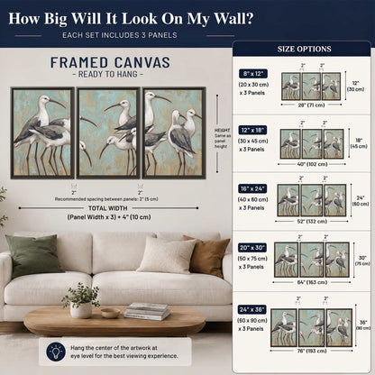 Long-legged white and gray wading birds against a muted aqua background 3 piece framed canvas wall art size guide above a sofa; room view is illustrative