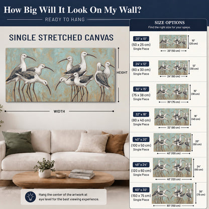 Long-legged white and gray wading birds against a muted aqua background single canvas wall art size guide above a sofa; room view is illustrative
