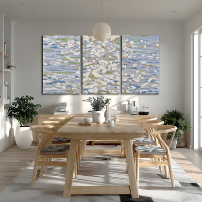 Loose pale blue, white and soft green marks suggesting shimmering water 3 piece canvas wall art room and product view