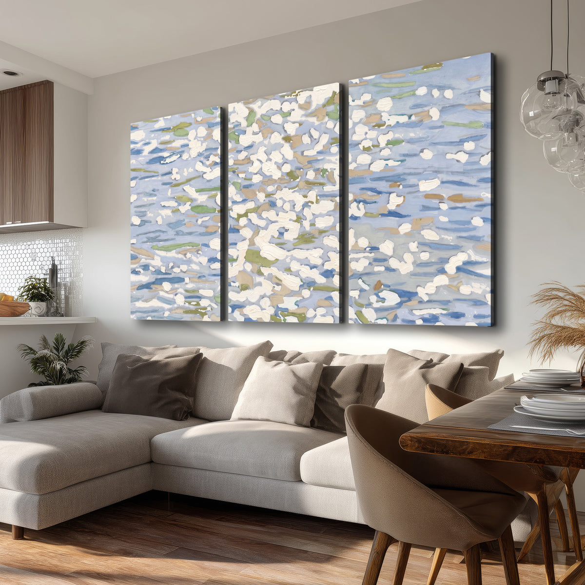 Loose pale blue, white and soft green marks suggesting shimmering water 3 piece canvas wall art room and product view