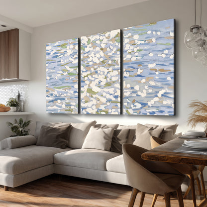 Loose pale blue, white and soft green marks suggesting shimmering water 3 piece canvas wall art room and product view