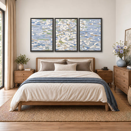 Loose pale blue, white and soft green marks suggesting shimmering water 3 piece framed canvas wall art styled in an interior