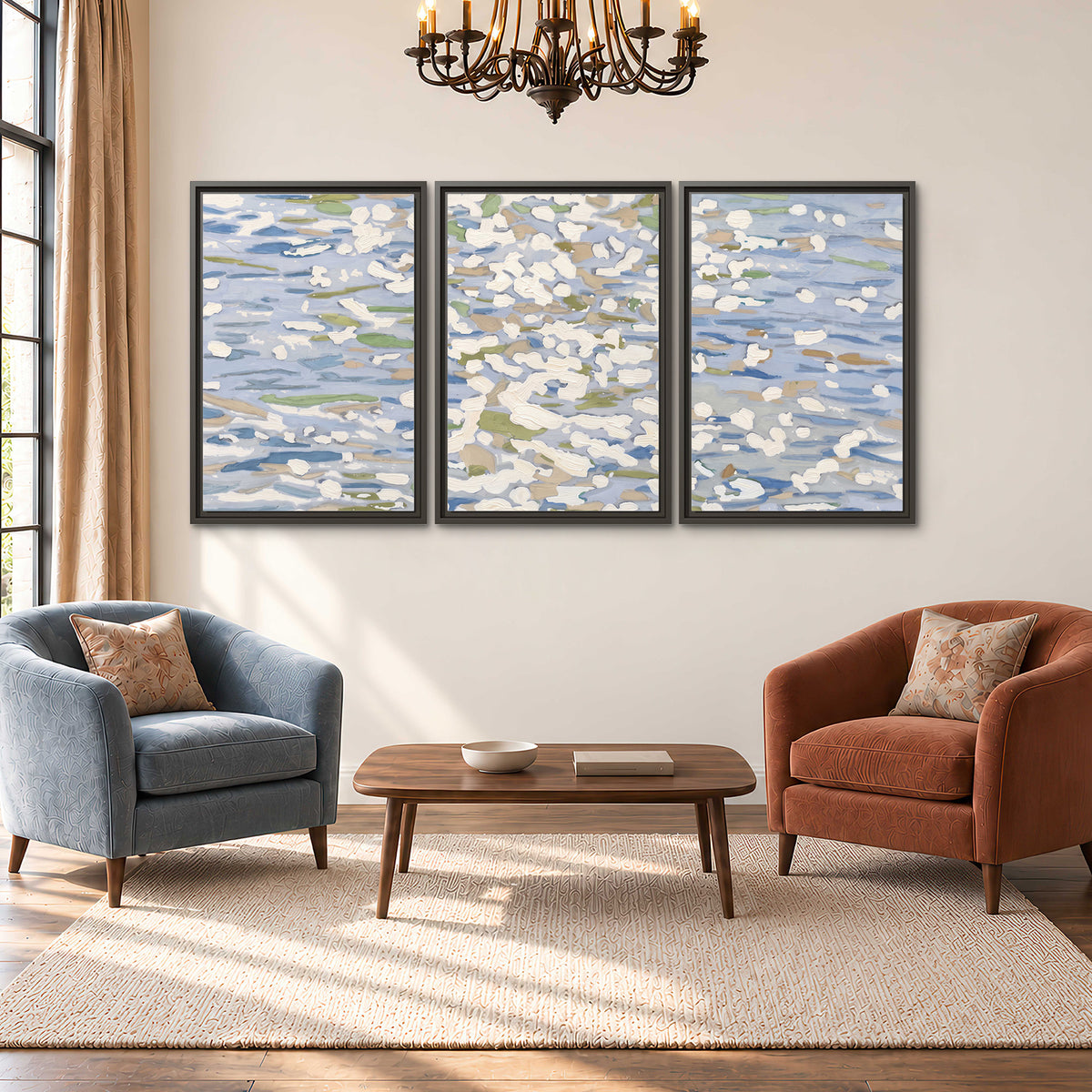 Loose pale blue, white and soft green marks suggesting shimmering water 3 piece framed canvas wall art styled in an interior