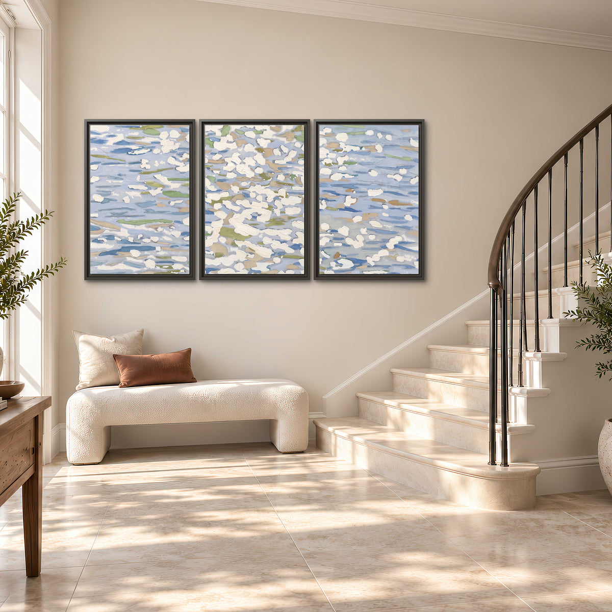 Loose pale blue, white and soft green marks suggesting shimmering water 3 piece framed canvas wall art styled in an interior
