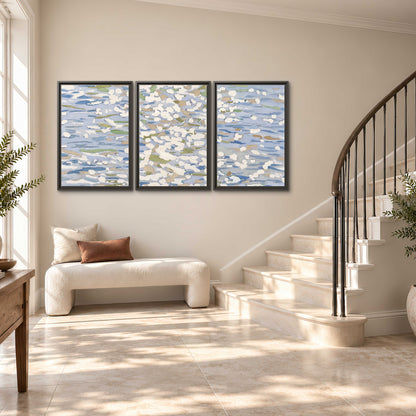 Loose pale blue, white and soft green marks suggesting shimmering water 3 piece framed canvas wall art styled in an interior