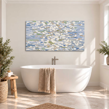Loose pale blue, white and soft green marks suggesting shimmering water single canvas wall art styled in an interior