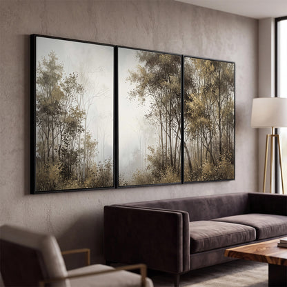 Tall autumn trees framing a pale misty woodland clearing 3 piece framed canvas wall art displayed in a modern living room