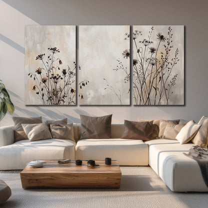 Fine dark wildflower stems and seed heads against soft beige 3 piece canvas wall art displayed in a living room