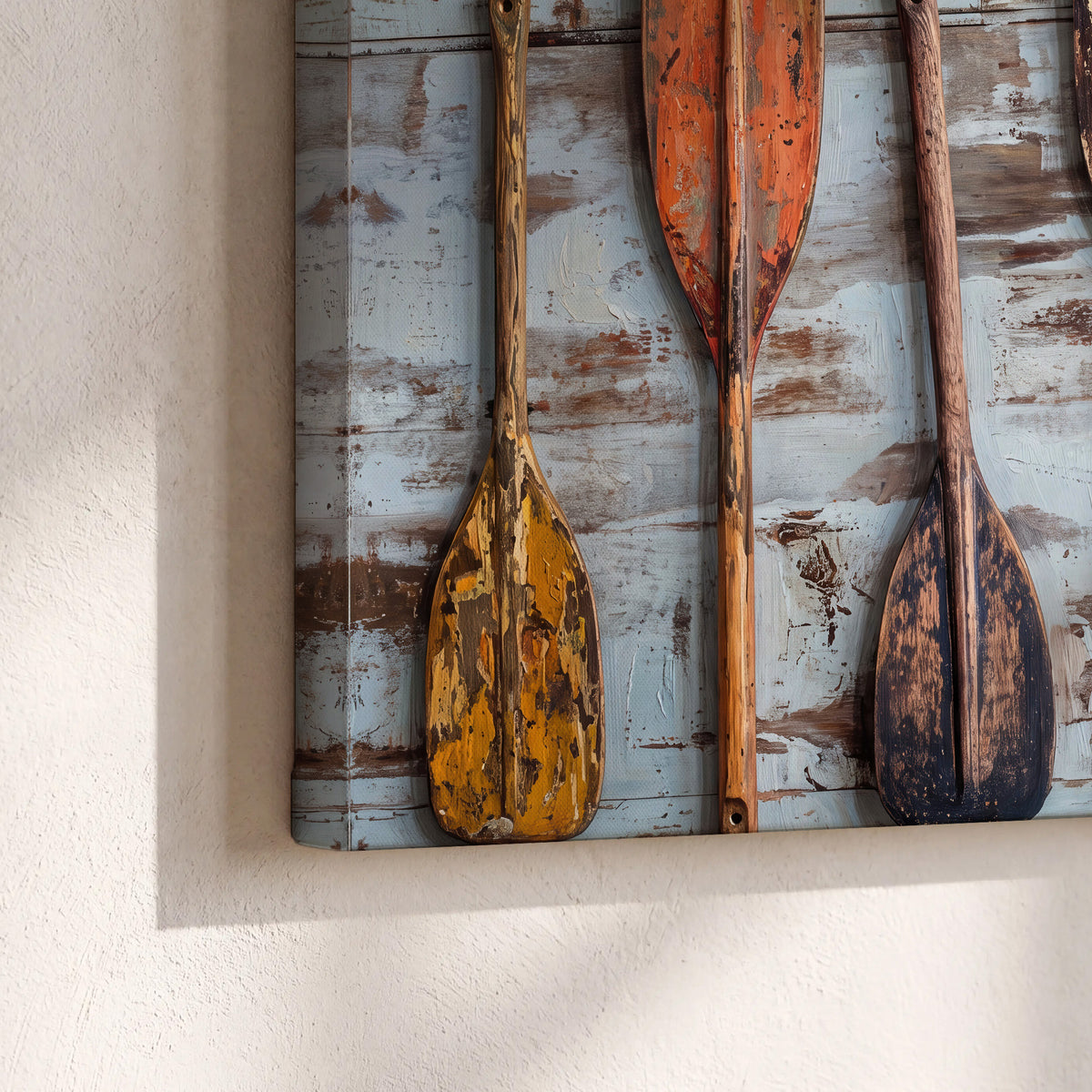 A row of colorful weathered wooden oars against pale blue boards 3 piece canvas wall art material and edge close up
