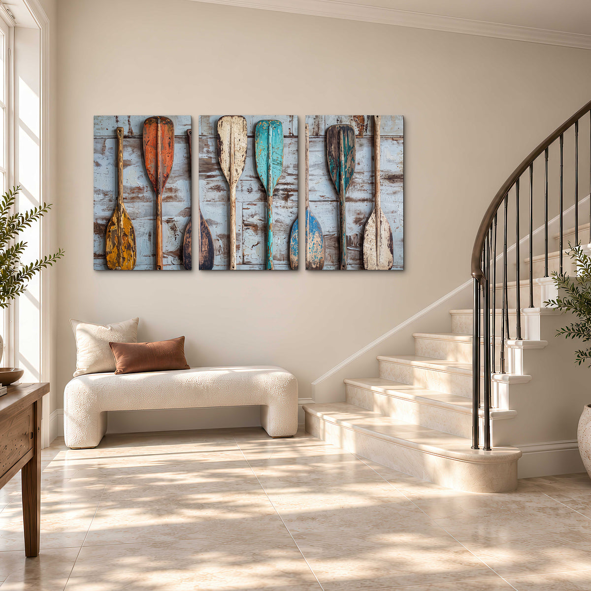 A row of colorful weathered wooden oars against pale blue boards 3 piece canvas wall art styled in an interior