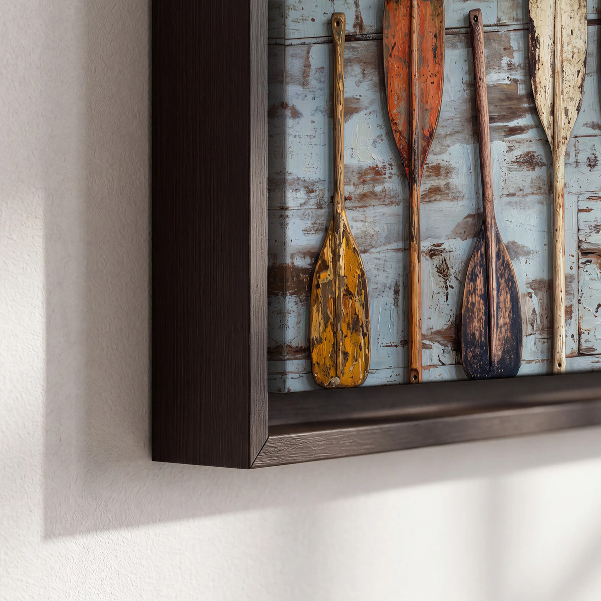 A row of colorful weathered wooden oars against pale blue boards 3 piece framed canvas wall art material and edge close up