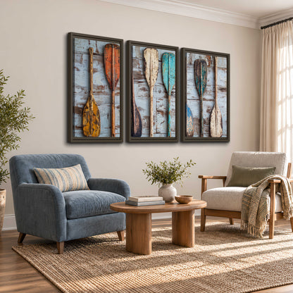 A row of colorful weathered wooden oars against pale blue boards 3 piece framed canvas wall art styled in an interior