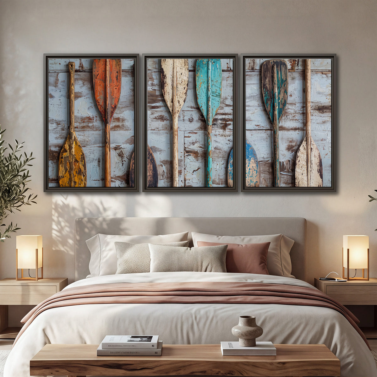 A row of colorful weathered wooden oars against pale blue boards 3 piece framed canvas wall art displayed in a bedroom