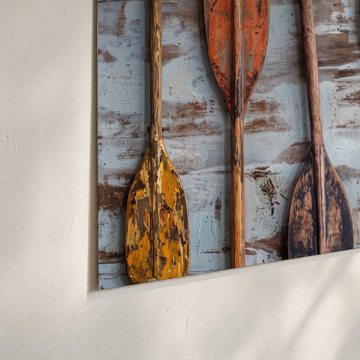 A row of colorful weathered wooden oars against pale blue boards set of 3 poster prints material and edge close up