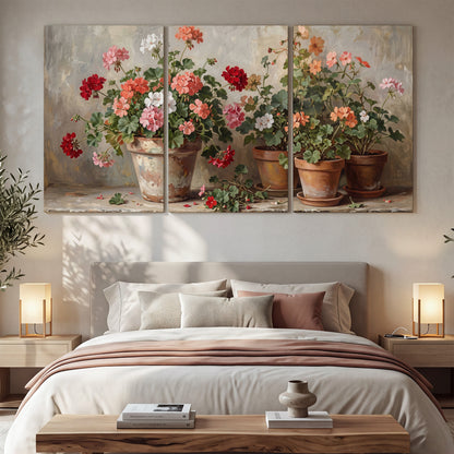 Colorful flowers arranged in rustic pots on a warm neutral background 3 piece canvas wall art displayed in a bedroom