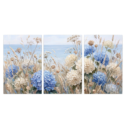 Blue hydrangeas and delicate ivory wildflowers beneath a pale blue sky 3 piece canvas wall art viewed straight on