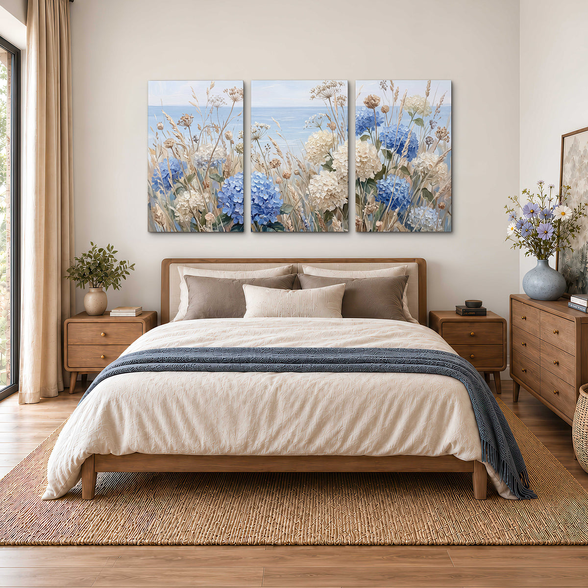 Blue hydrangeas and delicate ivory wildflowers beneath a pale blue sky 3 piece canvas wall art styled in an interior