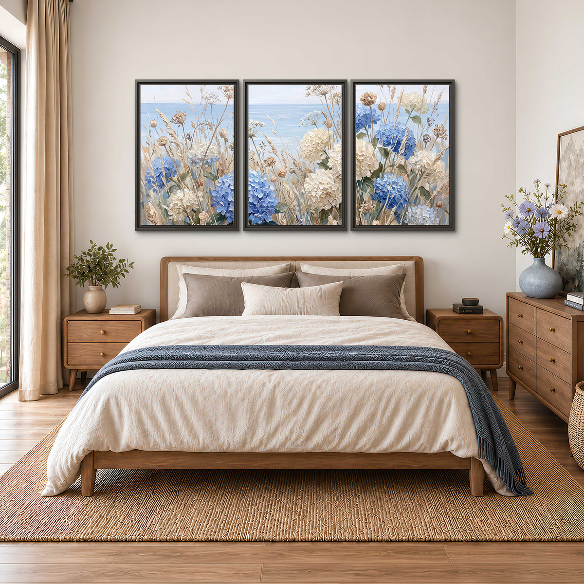 Blue hydrangeas and delicate ivory wildflowers beneath a pale blue sky 3 piece framed canvas wall art styled in an interior