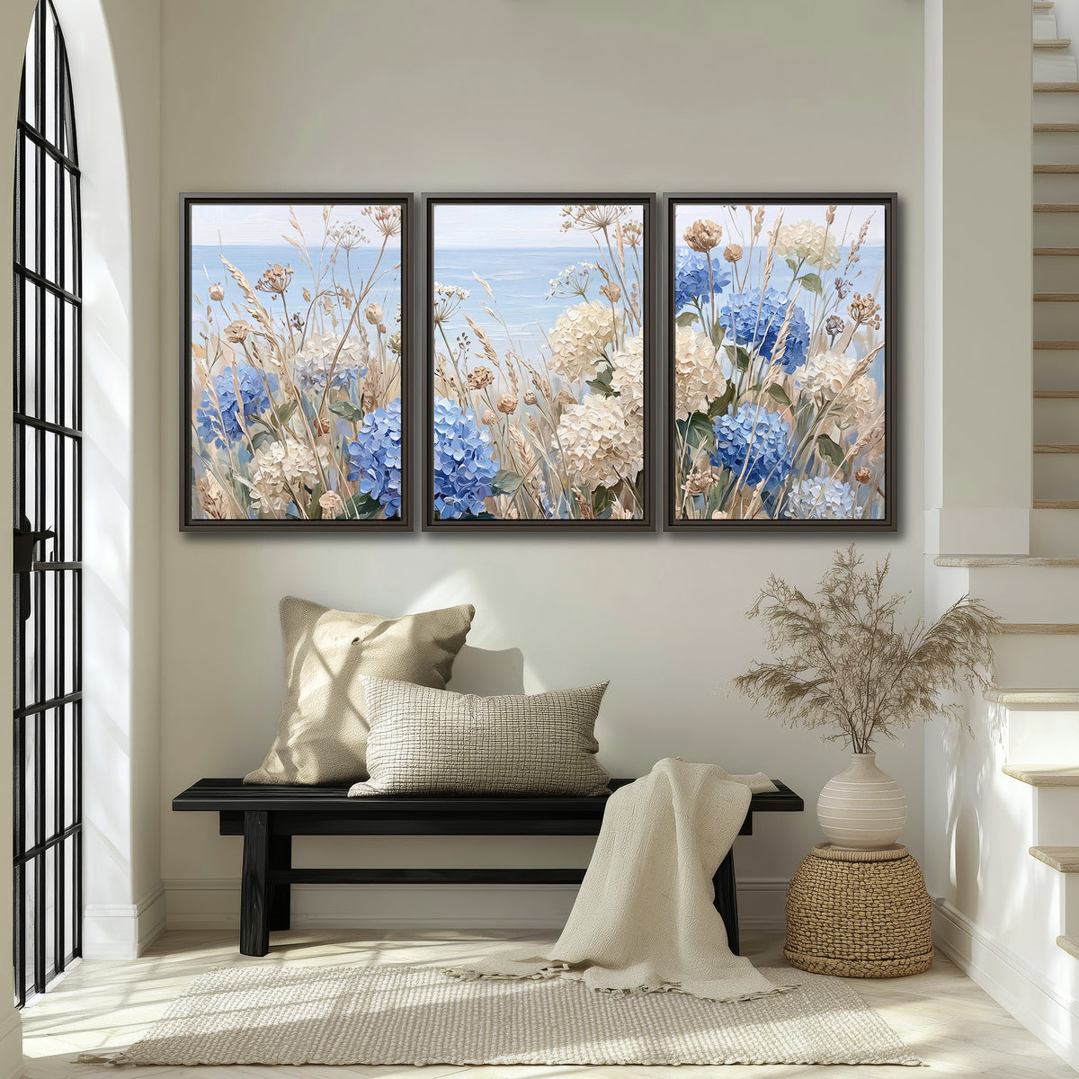 Blue hydrangeas and delicate ivory wildflowers beneath a pale blue sky 3 piece framed canvas wall art displayed in a entryway