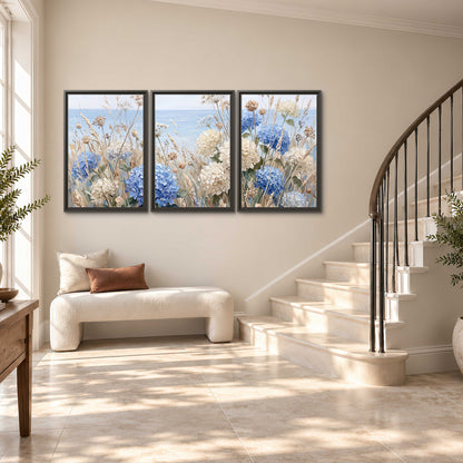 Blue hydrangeas and delicate ivory wildflowers beneath a pale blue sky 3 piece framed canvas wall art styled in an interior
