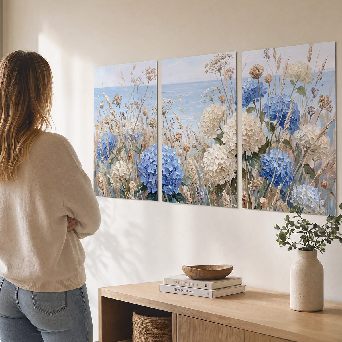 Blue hydrangeas and delicate ivory wildflowers beneath a pale blue sky set of 3 poster prints three panel arrangement on a wall