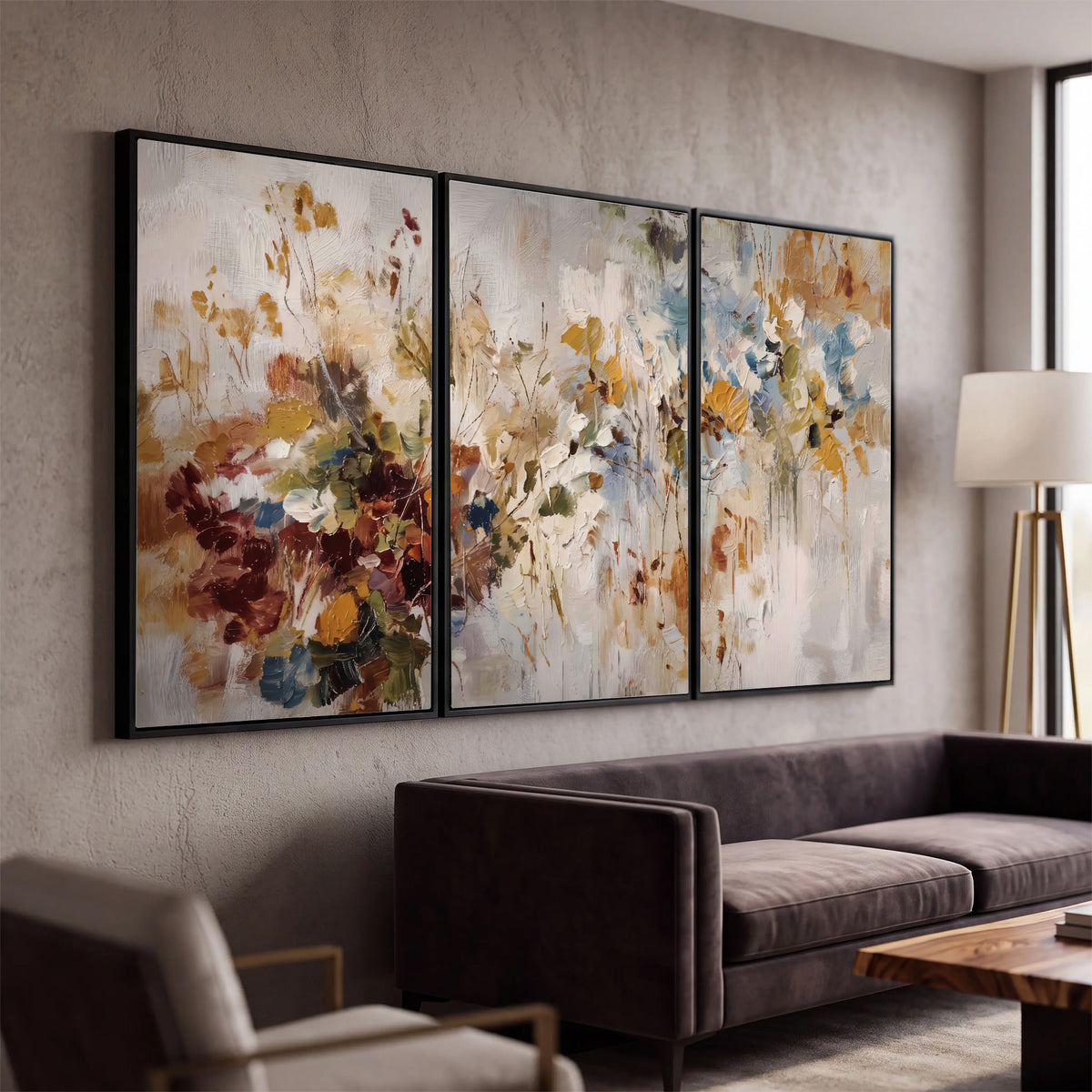 Loose cream, ochre and rust floral shapes with expressive painted-style marks 3 piece framed canvas wall art displayed in a modern living room
