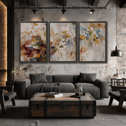 Loose cream, ochre and rust floral shapes with expressive painted-style marks 3 piece framed canvas wall art displayed in a industrial room
