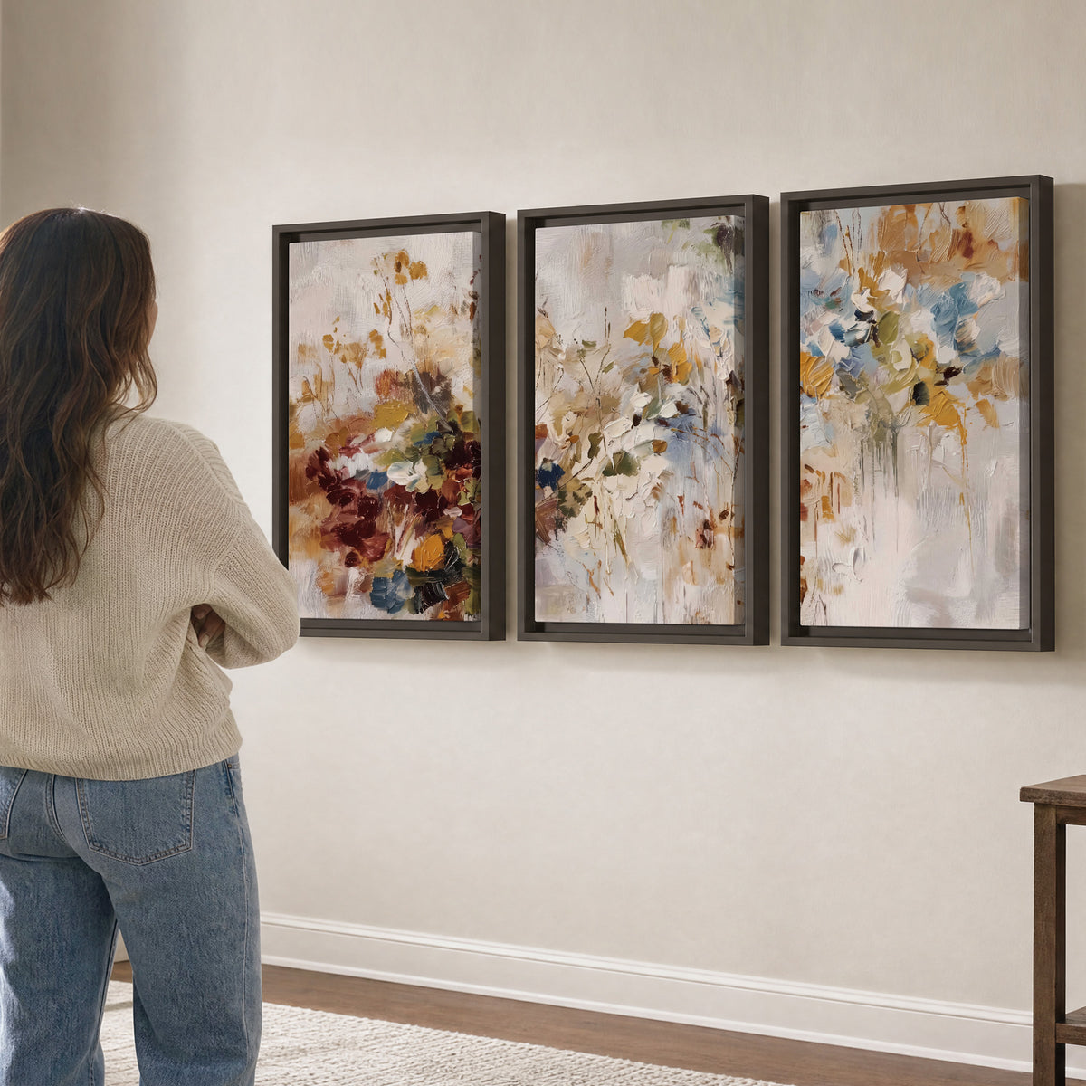 Loose cream, ochre and rust floral shapes with expressive painted-style marks 3 piece framed canvas wall art three panel arrangement on a wall