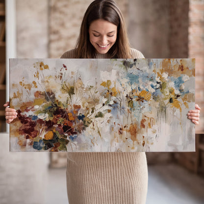 Loose cream, ochre and rust floral shapes with expressive painted-style marks single canvas wall art held in hands