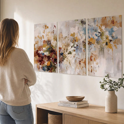 Loose cream, ochre and rust floral shapes with expressive painted-style marks set of 3 poster prints three panel arrangement on a wall
