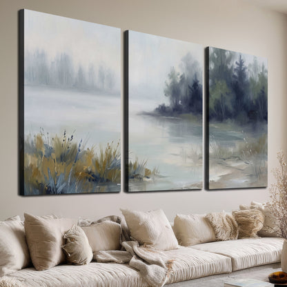 A calm pale lake bordered by dark evergreen trees and distant mist 3 piece canvas wall art room and product view