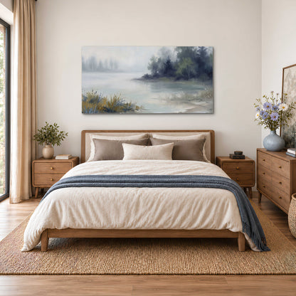 A calm pale lake bordered by dark evergreen trees and distant mist single canvas wall art styled in an interior