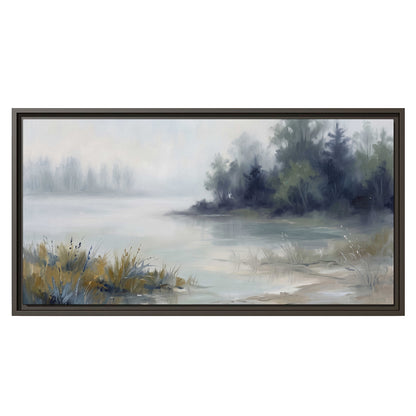 A calm pale lake bordered by dark evergreen trees and distant mist single framed canvas wall art viewed straight on