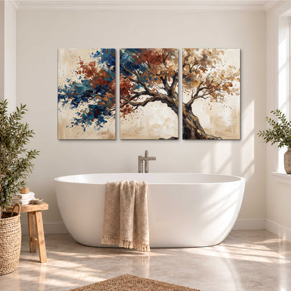 A broad tree with rust, blue and ochre foliage against warm cream 3 piece canvas wall art styled in an interior