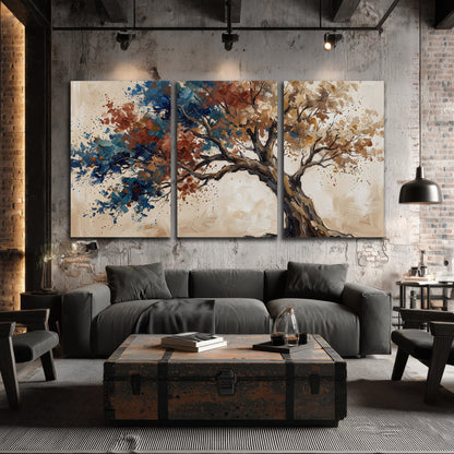 A broad tree with rust, blue and ochre foliage against warm cream 3 piece canvas wall art displayed in a industrial room