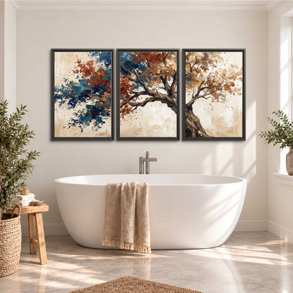 A broad tree with rust, blue and ochre foliage against warm cream 3 piece framed canvas wall art styled in an interior